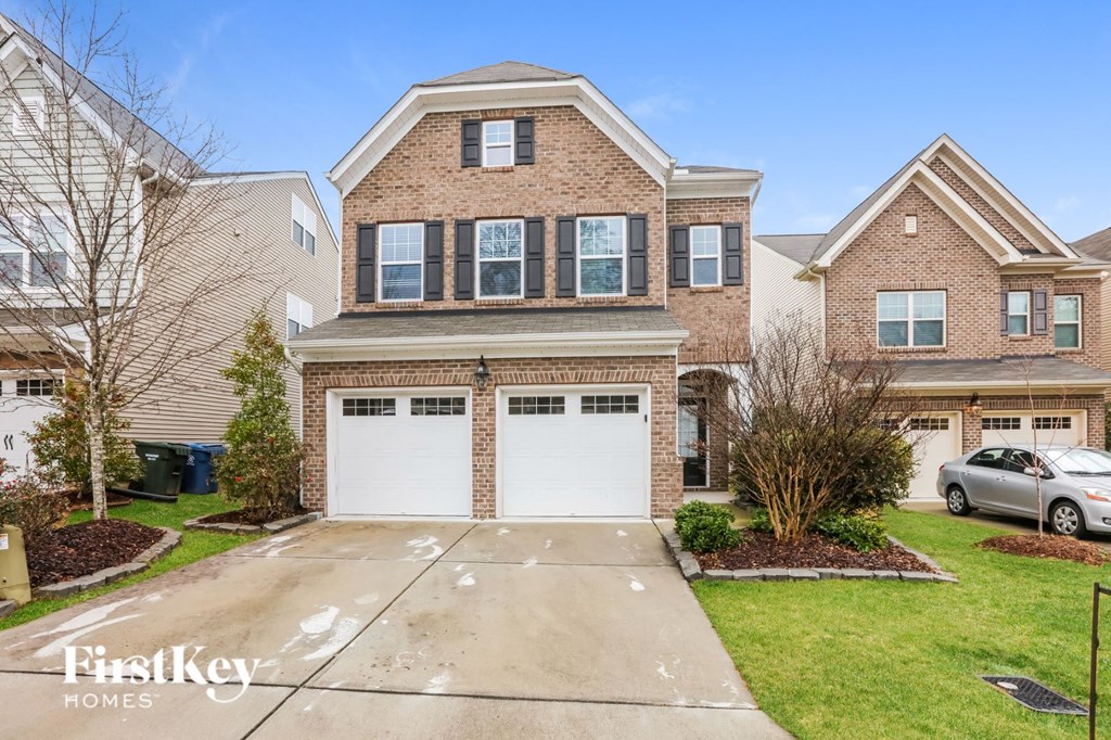 a house with a white garage door in front of it