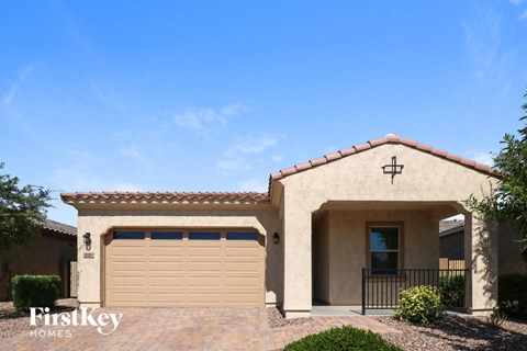 a house with a garage door in front of it