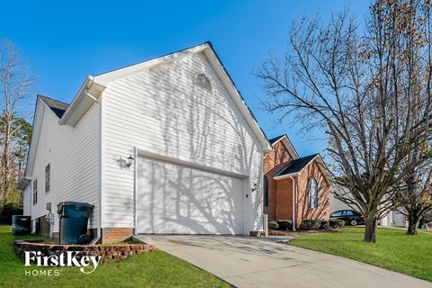 a white church building with a white garage door