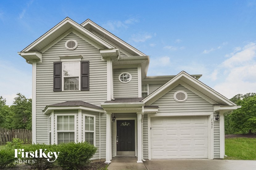 a white house with a white garage door