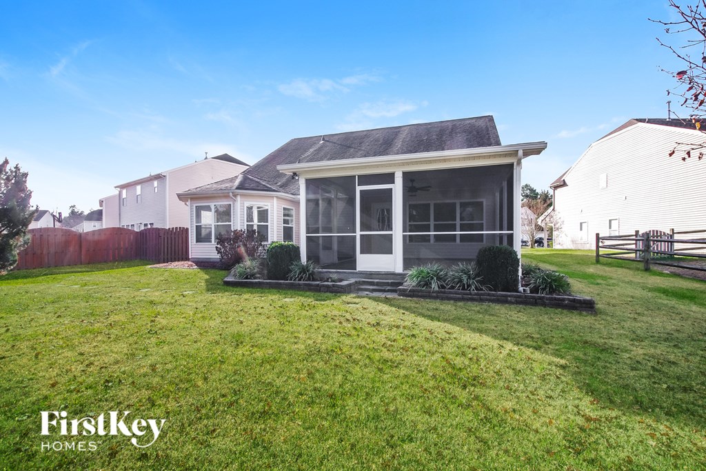 A house with a lawn in front of it.