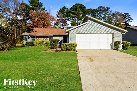 A house with a garage is for sale by FirstKey Homes.
