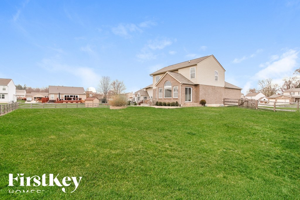 A house with a lawn in front of it is for sale with FirstKey Homes.