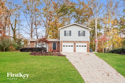 A house with a driveway in front of it.