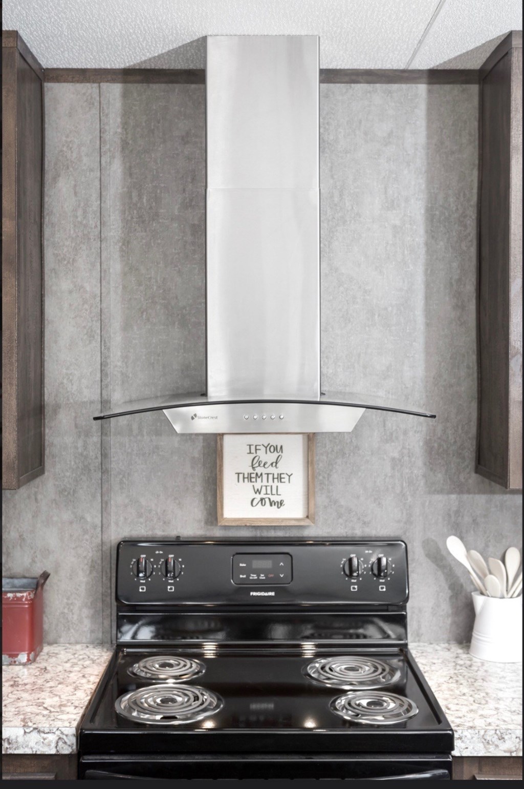 a kitchen with a stove and a stove top oven