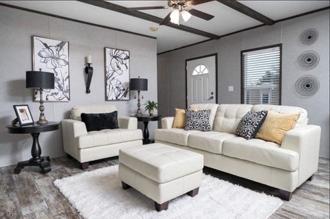 a living room with a couch and a chair