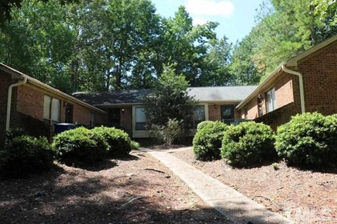 A residential area with houses and trees.