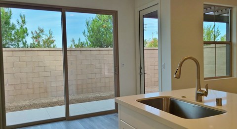 A kitchen with a sink and a window.