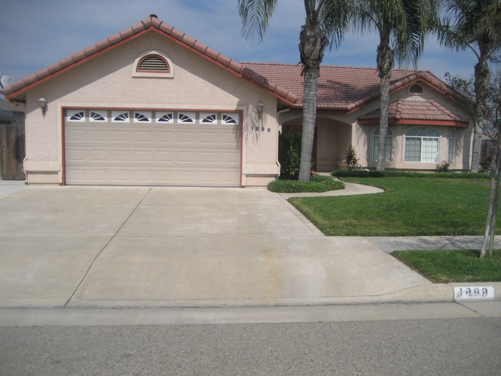 a house with a driveway and a garage door