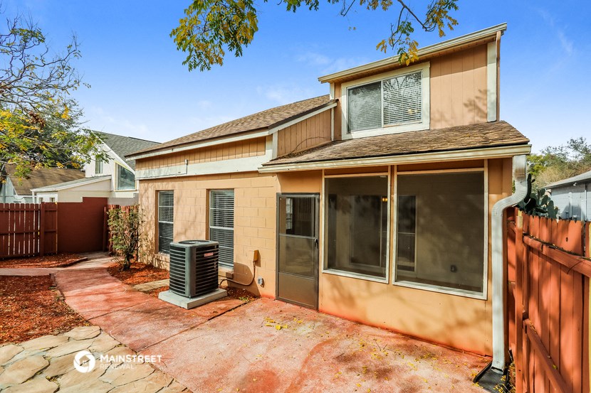 a house with a yard and a heater in front of it
