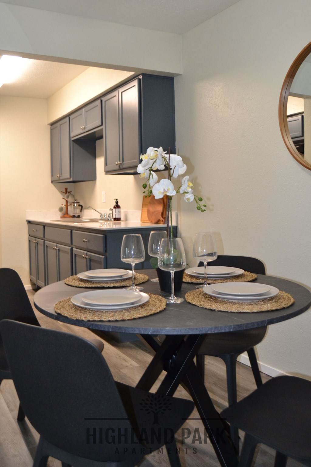a dining room with a table and chairs and a kitchen