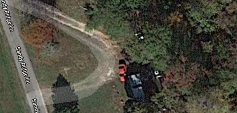 A car is parked on the side of a road.