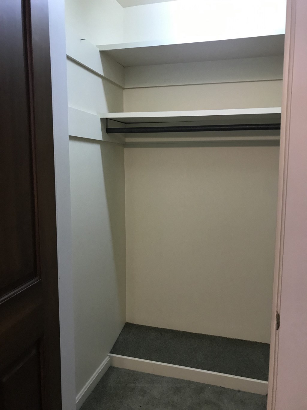 the closet in the master bedroom has a shelf above it
