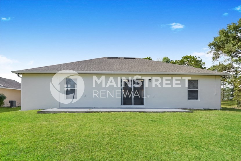 a house with a lawn in front of it