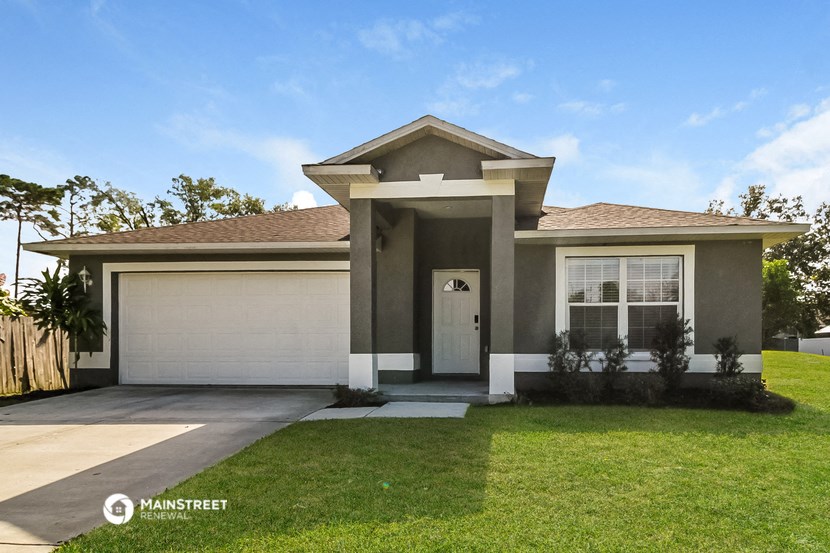 a house with a lawn in front of it