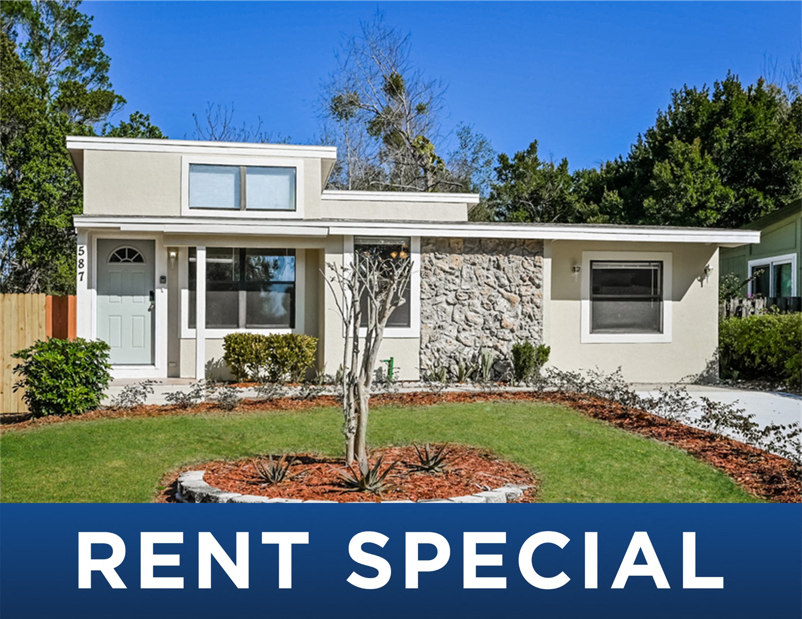 the real estate rental special sign in front of a house