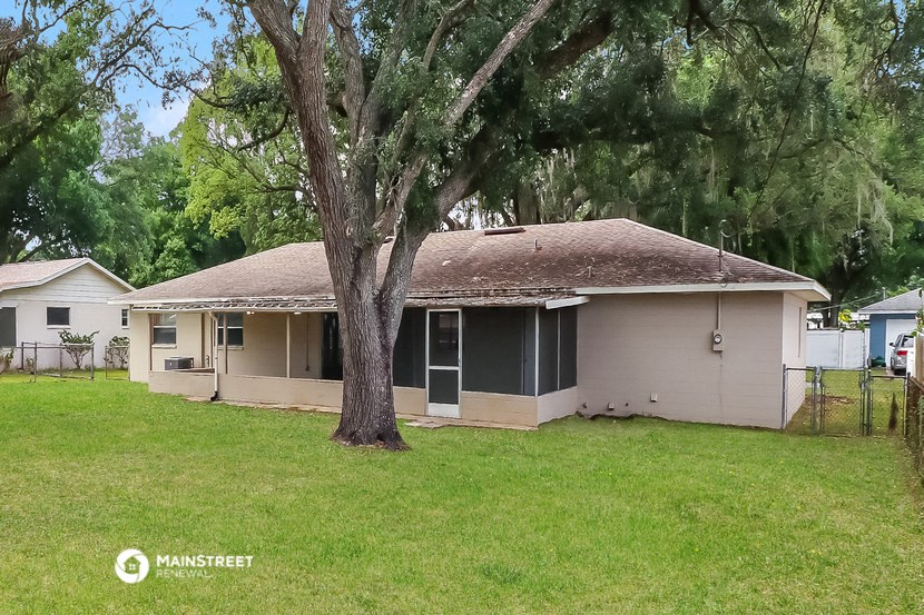 a house with a tree in front of it