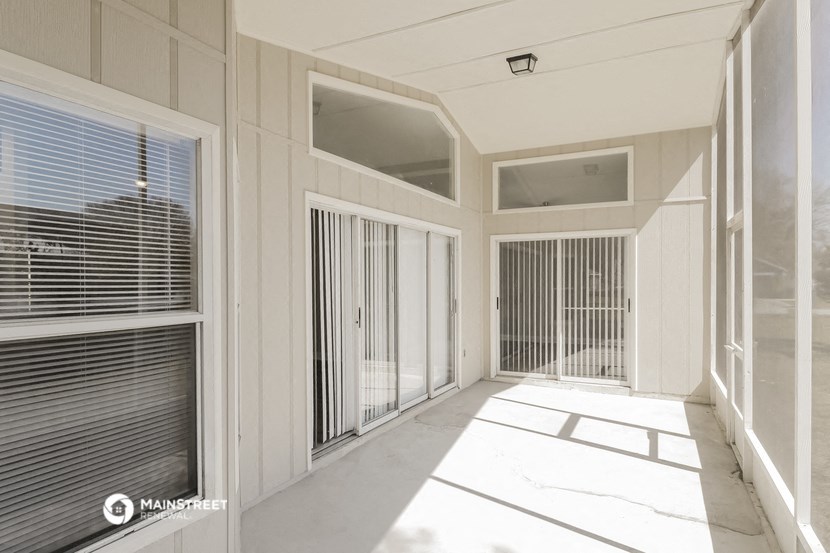 a view of the inside of a building with blinds on the windows