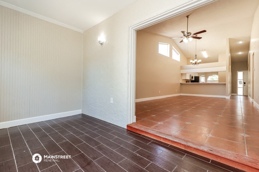 the living room is open to the dining room and kitchen