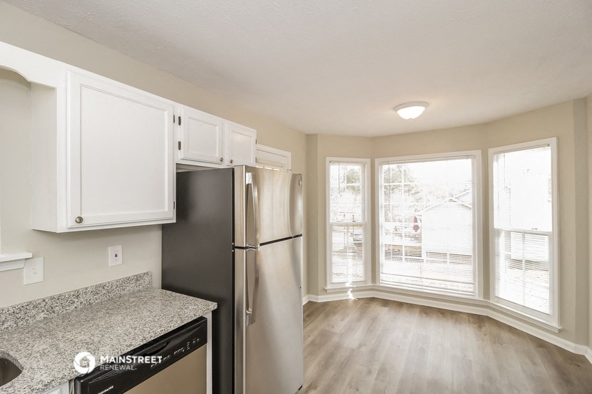 a kitchen with stainless steel appliances and a window