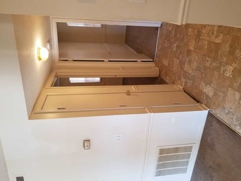 a kitchen with two drawers and a counter top