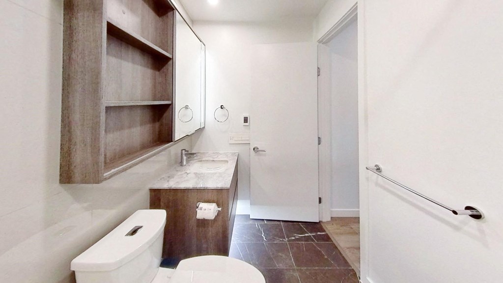 a bathroom with a toilet and a sink