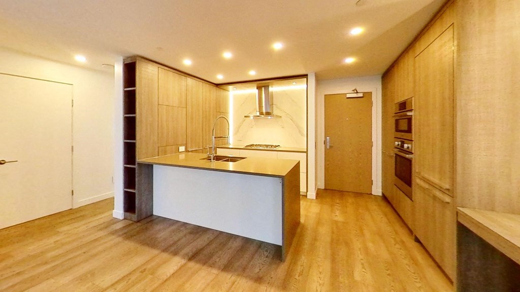 a kitchen with a counter top and a sink