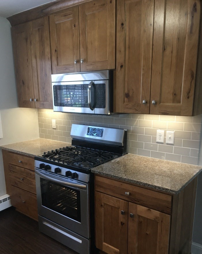 a kitchen with a stove and a microwave