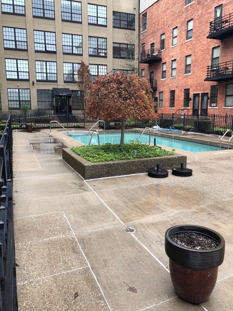 a swimming pool in front of an apartment building