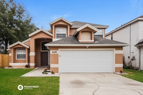 a house with a white garage door in front of it