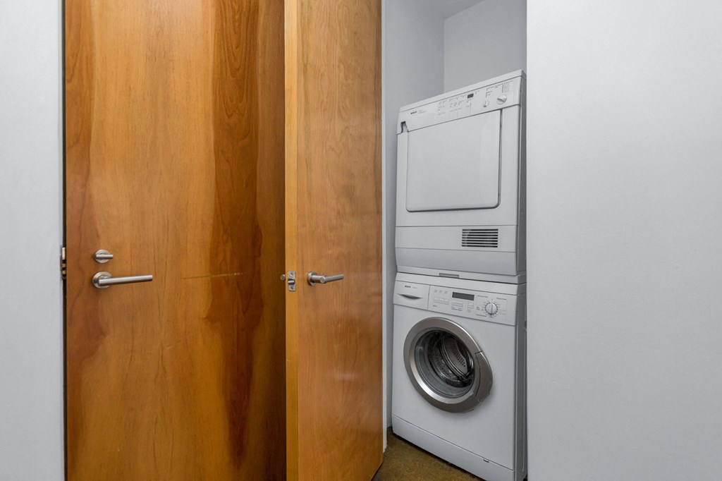 a small laundry room with a washer and dryer