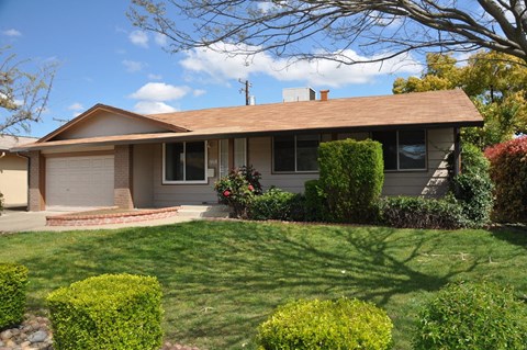 a house with a lawn in front of it