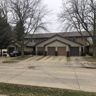 a house with a driveway and a garage door