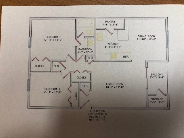 A floor plan of a house with two bedrooms, a pantry, a dining room, a kitchen, a living room, a balcony, and a storage area.