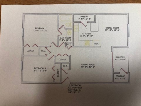 A floor plan of a house with two bedrooms, a pantry, a dining room, a kitchen, a living room, a balcony, and a storage area.