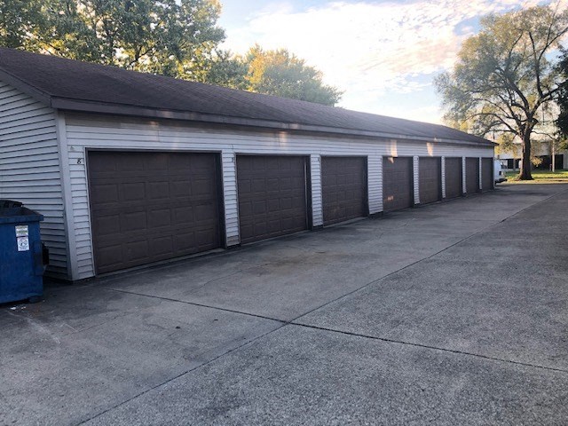 A long building with a row of garage doors.