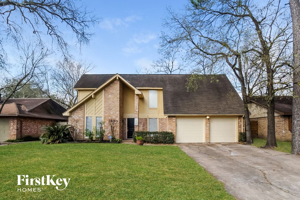 A house with a brown roof and a garage door is shown.