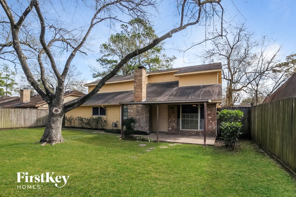 A house with a tree in front of it.
