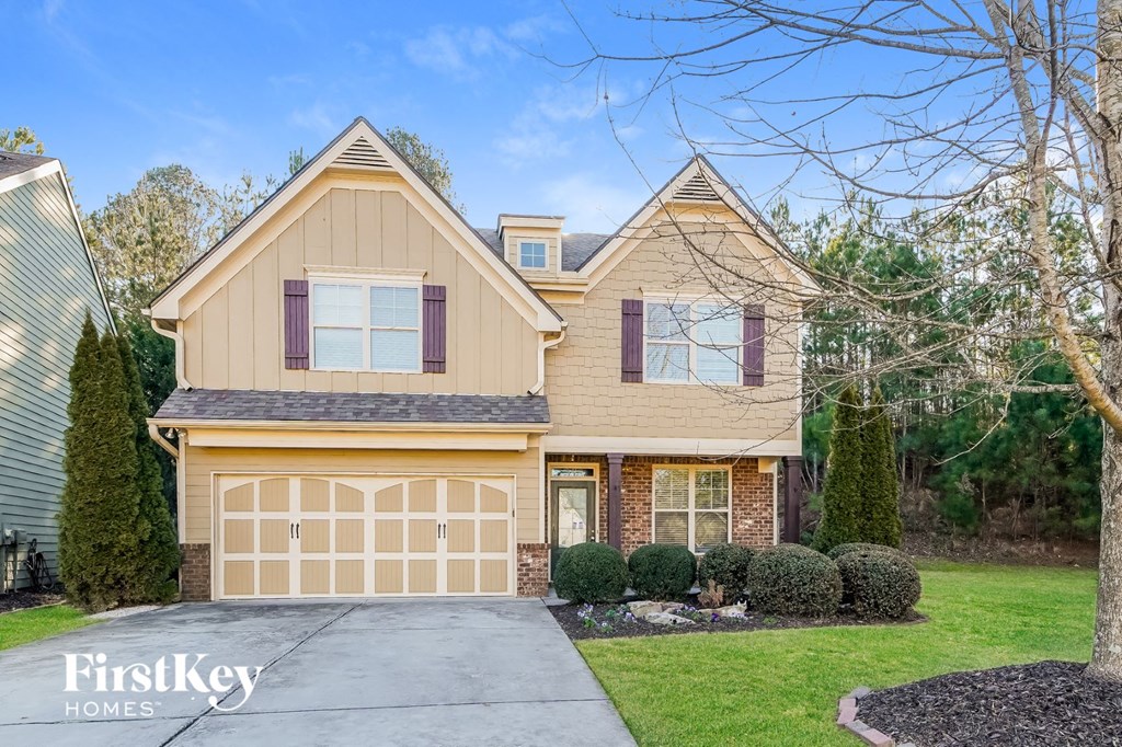 A two-story house with a garage is for sale by FirstKey Homes.