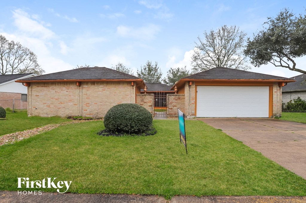 A house with a sign that says FirstKey Homes.
