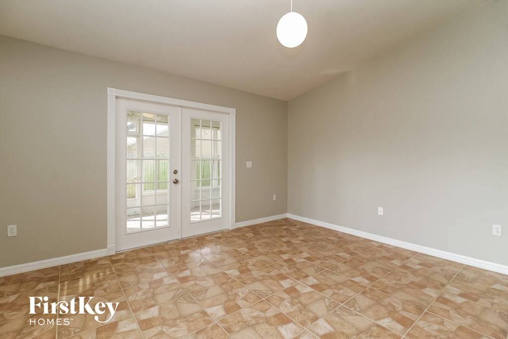 the spacious living room doors to the patio