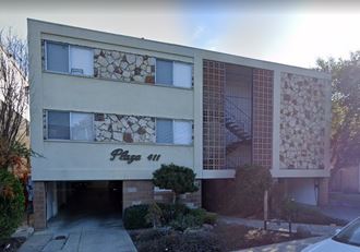 an office building with a sign on the front of it