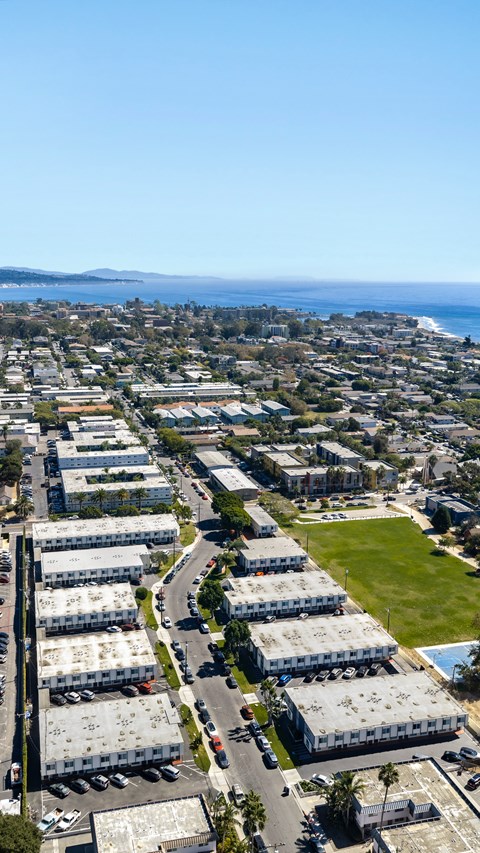 A view of a city with buildings and a road.