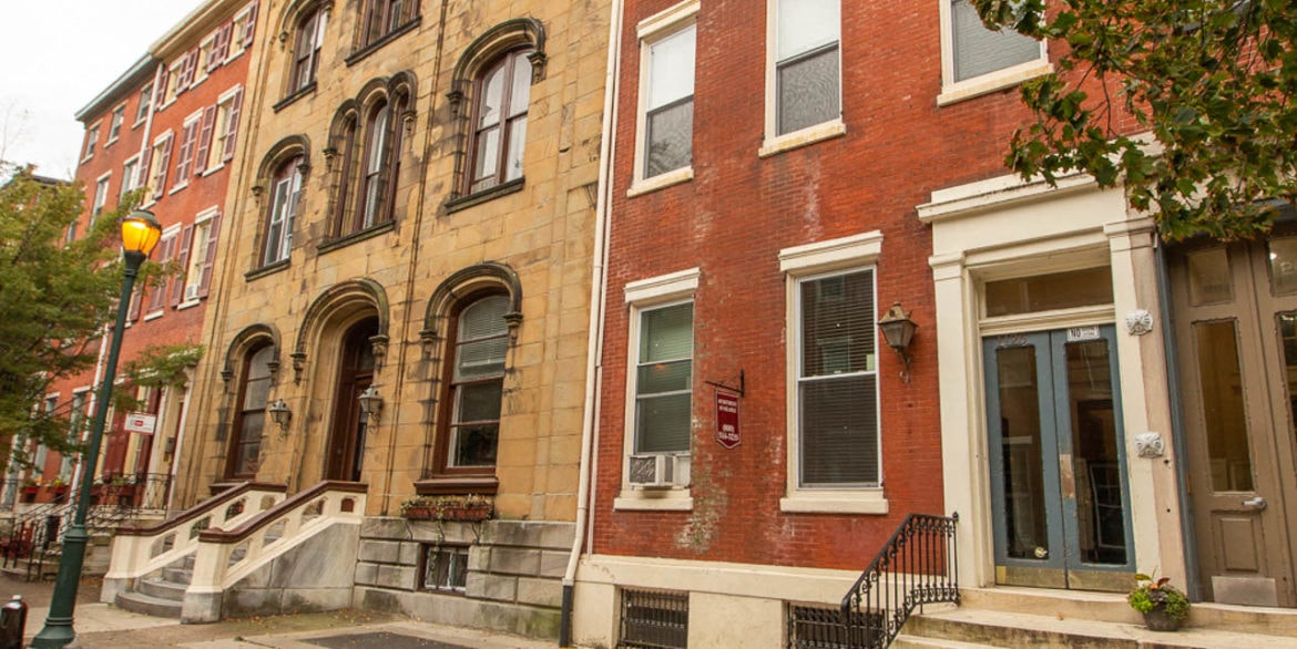 a couple of buildings on a city street