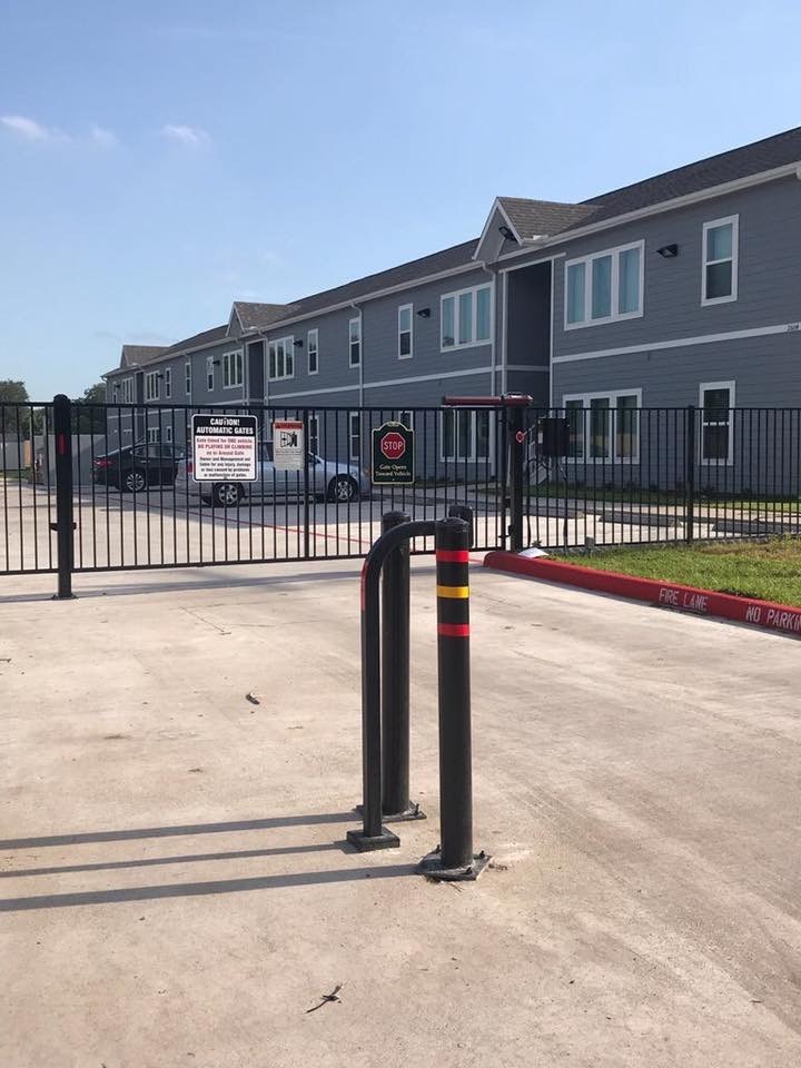 a parking lot in front of an apartment building
