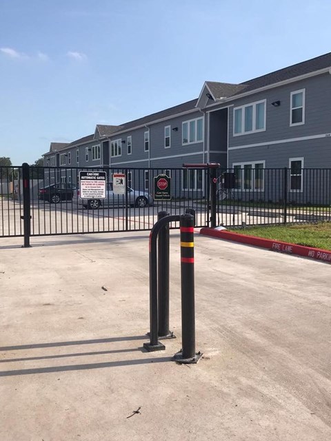 a parking lot in front of an apartment building