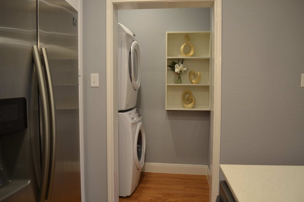 a small laundry room with a washer and dryer in it