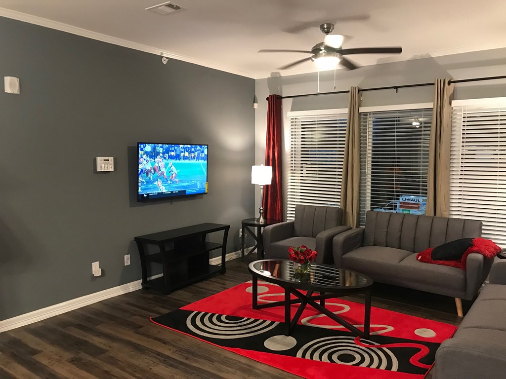 a living room with a couch and a table and a tv