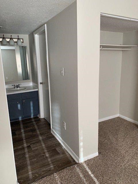 an empty bathroom with a sink and a mirror