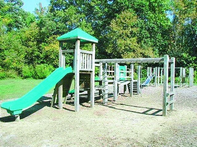 a childrens playground with a slide and